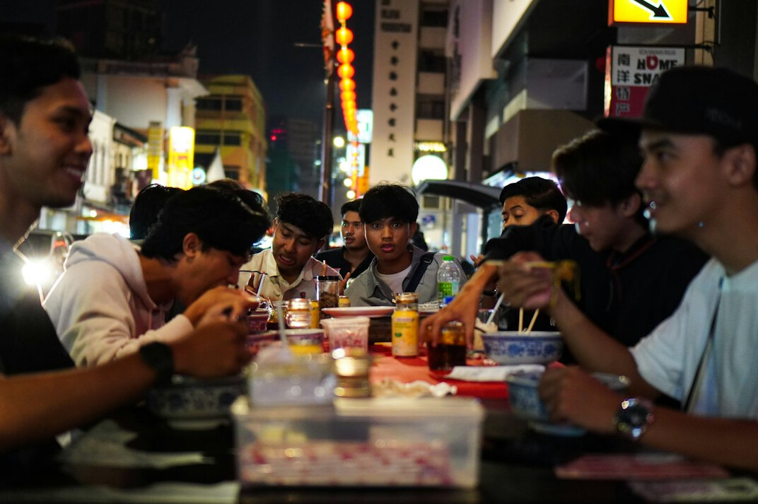 Team of journalists meeting around a table