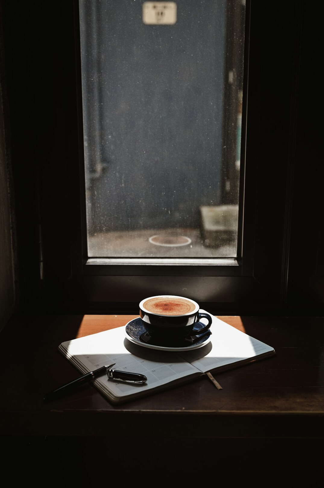 Journalist desk with notebook and coffee
